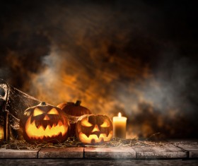 Pumpkin on old wooden table flame background Stock Photo 01