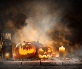 Pumpkin on old wooden table flame background Stock Photo 02