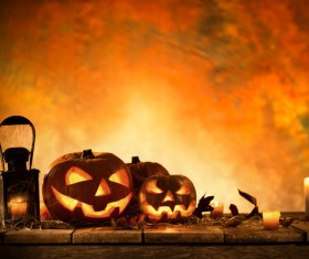 Pumpkin on old wooden table flame background Stock Photo 07