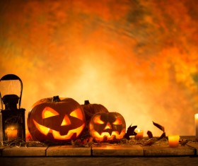 Pumpkin on old wooden table flame background Stock Photo 08