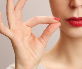 Red lips and OK gestures