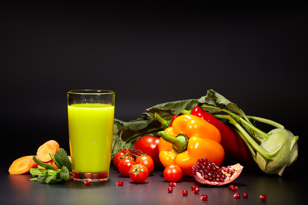 Red vegetables with green vegetable juice Stock Photo