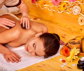 Relaxing woman with half-naked beauty massage spaStock Photo
