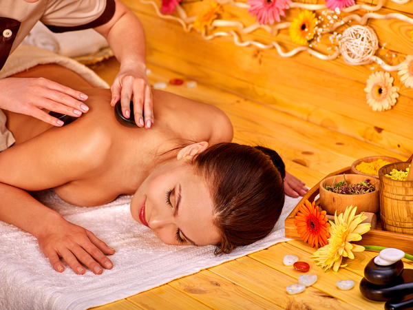 Relaxing woman with half-naked beauty massage spaStock Photo