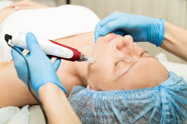 Skin examining women with medical equipment