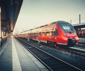 Sunset under the platform with red train Stock Photo