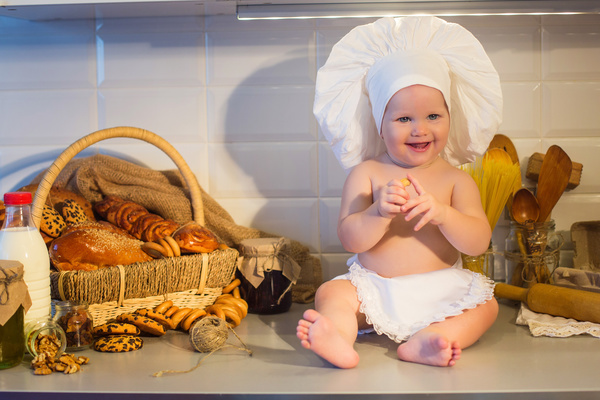 The cook costume Baby and bread Stock Photo