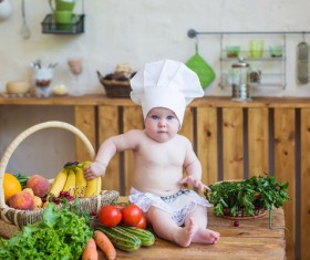 The cook costume Baby and fruit Stock Photo