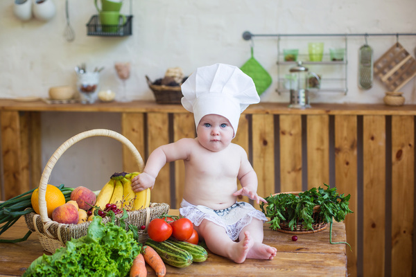 The cook costume Baby and fruit Stock Photo