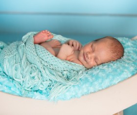 The newborn sleeps on the shaker Stock Photo