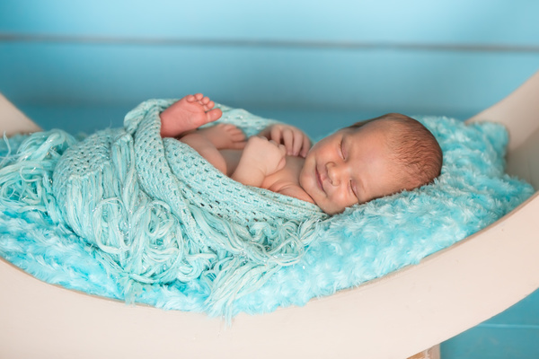 The newborn sleeps on the shaker Stock Photo