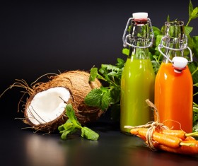 Vegetable juice with open coconut Stock Photo
