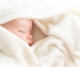 White blanket wrapped in newborn baby Stock Photo