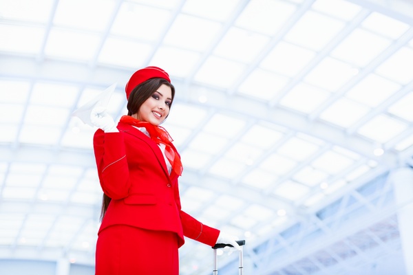 White ceiling under the hand of a paper airplane flight attendants Stock Photo