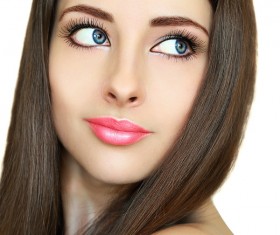Young beautiful woman with black hair and multicolor make-up