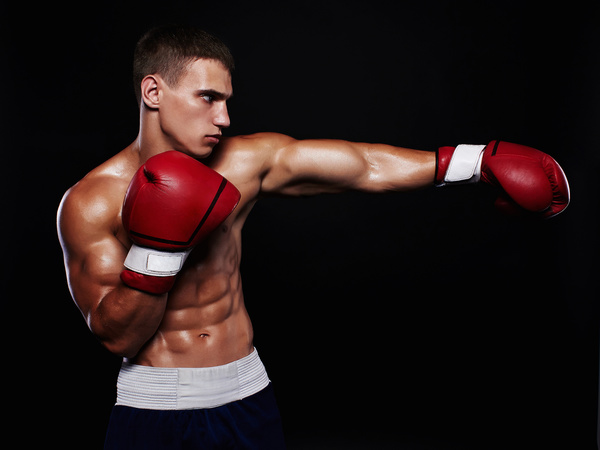 Young boxer with a black background Stock Photo