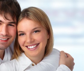 Young couple embracing happy smile