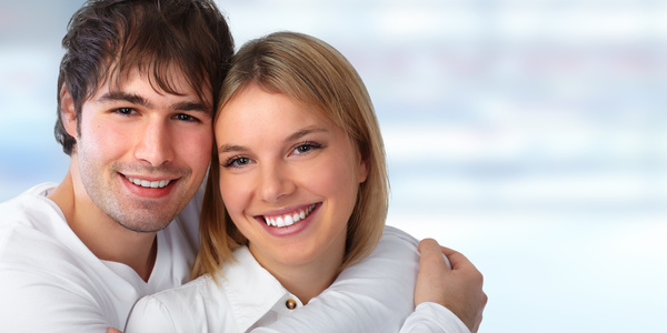 Young couple embracing happy smile