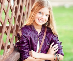 A blonde little girl with a sweet smile