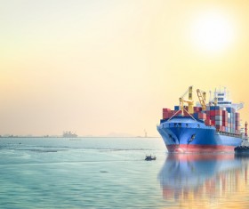 A ship loaded with cargo under the setting sun HD picture 02