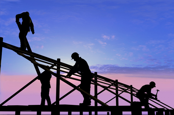 A worker on a roof Stock Photo