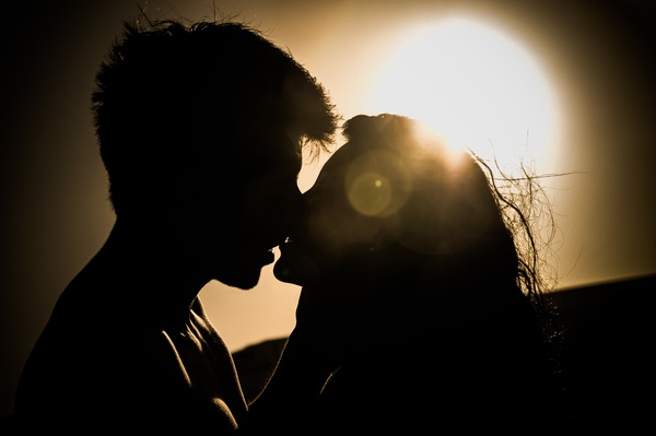 Sunset intimate couple Stock Photo