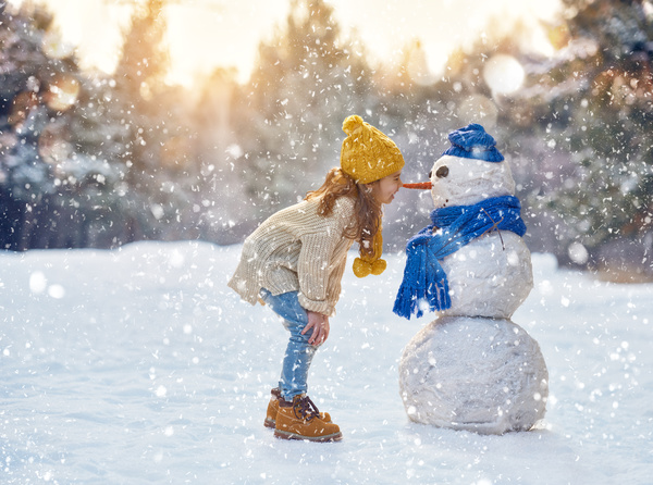 And snow children close interaction with children Stock Photo