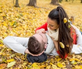 Autumn in the park Sweet young couple Stock Photo