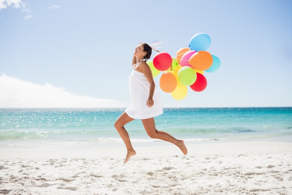 Beach girl with balloons Stock Photo