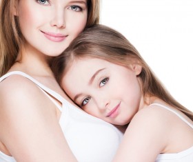 Beautiful young mother with arms in the daughter Stock Photo