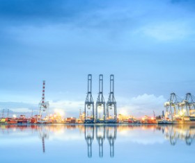 Bright dock with docked freighter HD picture