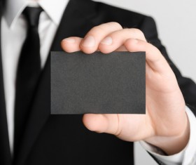 Business people with black business cards Stock Photo