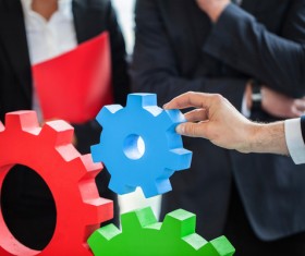 Businessman with colored gears