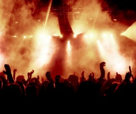 Cheering crowd of rock concerts with fireworks