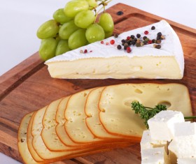 Cheese with grapes on the plate Stock Photo