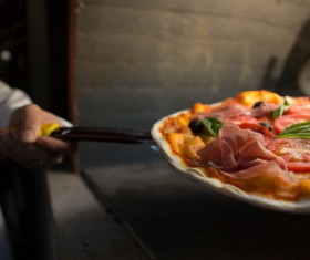 Chef bakes delicious pizza Stock Photo