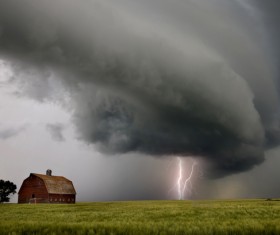 Clouds of lightning over the farm Stock Photo
