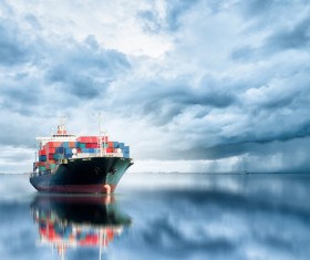Cloudy sky and sailing freighter HD picture