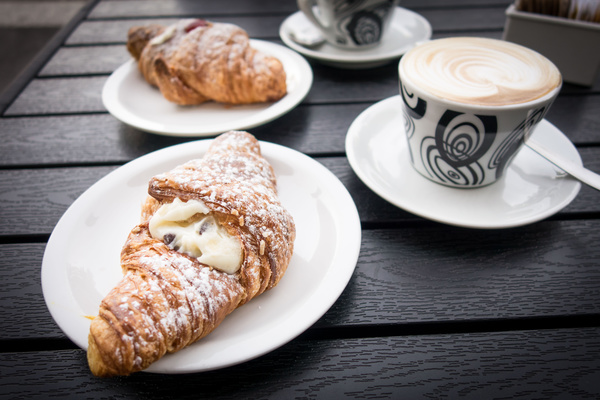 Delicious delicious croissant with coffee breakfast