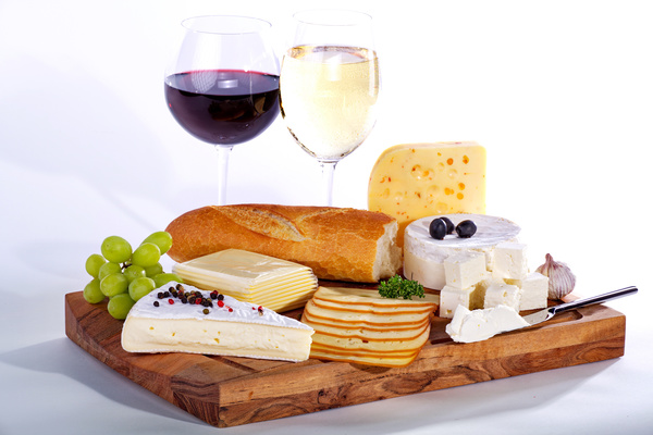 Dinner board with wine and food Stock Photo