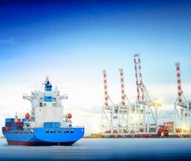 Freighter sailing with quay cranes HD picture