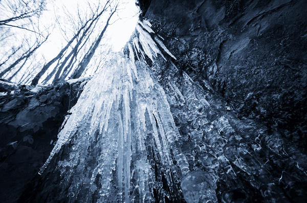 Frozen into icicles of the stream Stock Photo