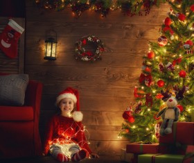 Girl with Christmas tree covered with gifts Stock Photo