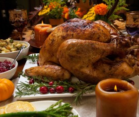 Grilled turkey and candles on the Thanksgiving table Stock Photo