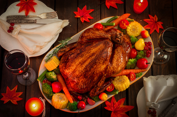 Grilled turkey and tableware on the Thanksgiving table Stock Photo