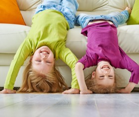 Happy child standing upside down HD picture