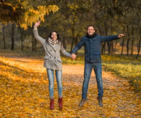 Happy jumping husband and wife HD picture