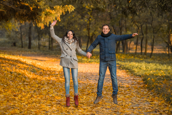 Happy jumping husband and wife HD picture