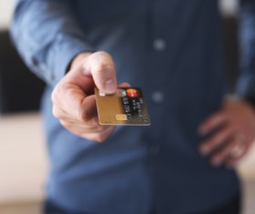 Holding a credit card Stock Photo