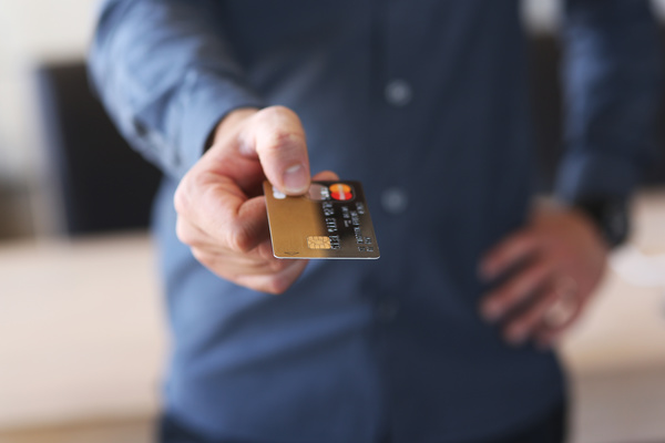 Holding a credit card Stock Photo